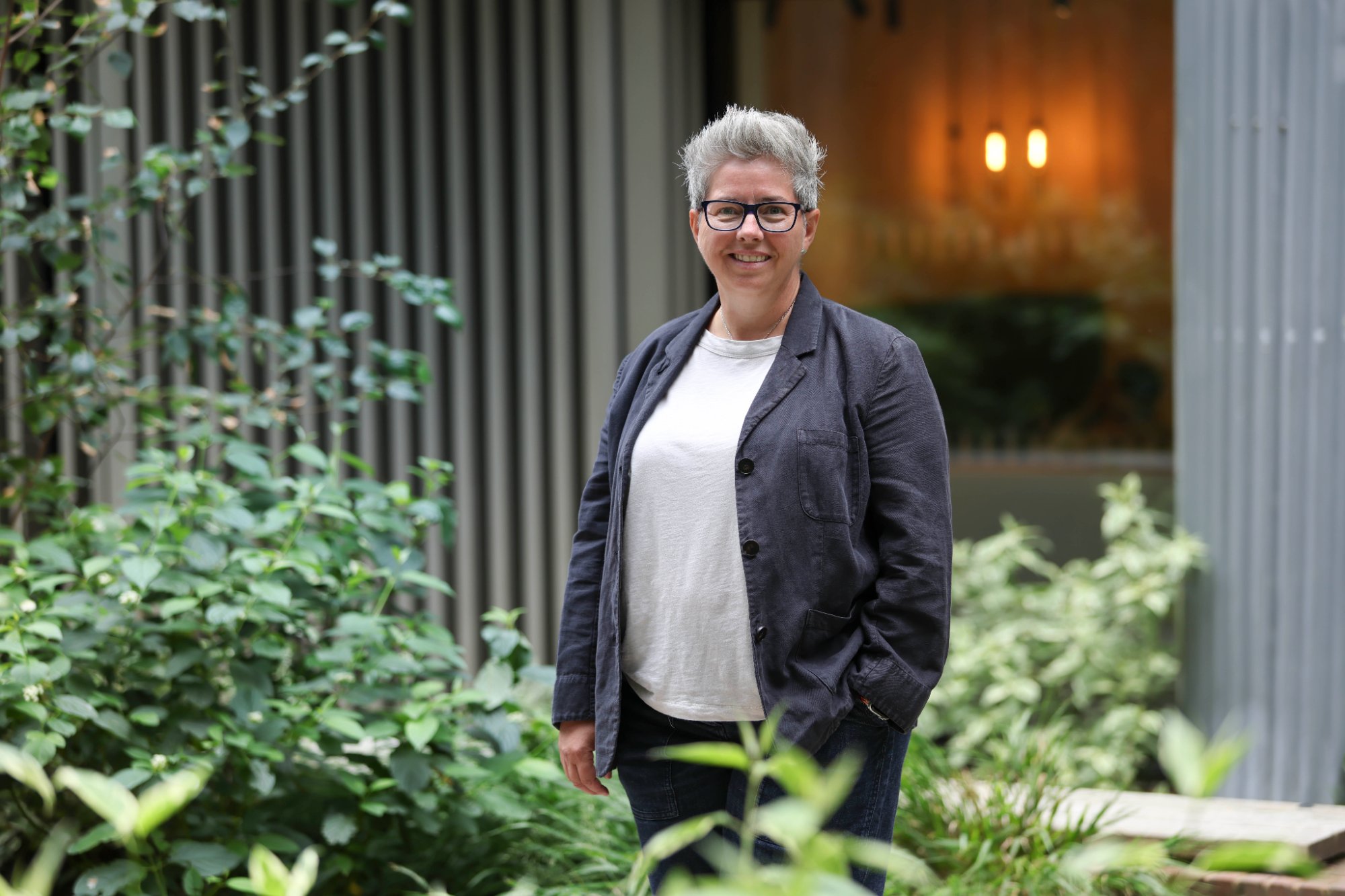 Caron Saul, founder of KinAi AI consultancy, standing outdoors in Brighton